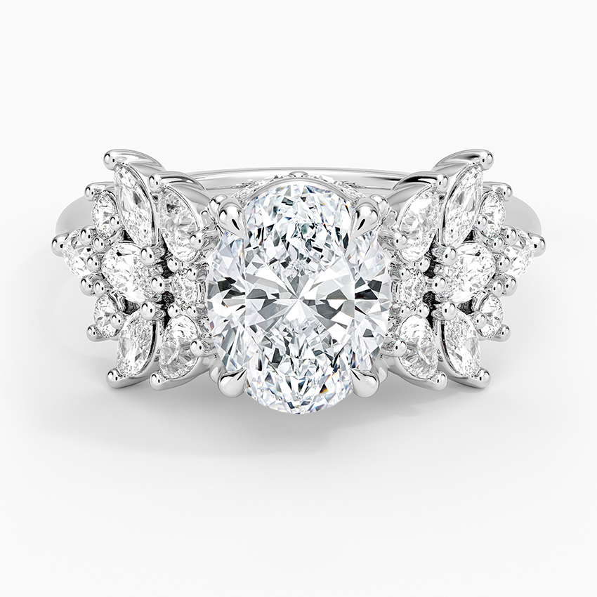 Oval moissanite with marquise and pear cluster wings in white gold, top view