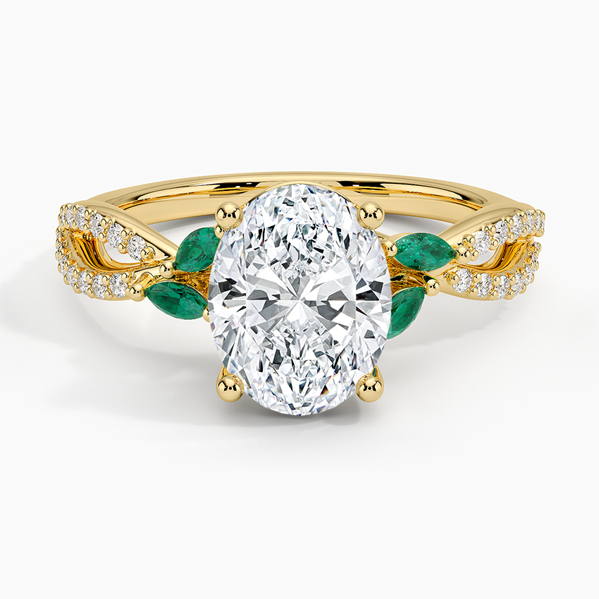 Oval moissanite with green marquise emerald leaves in yellow gold, top view