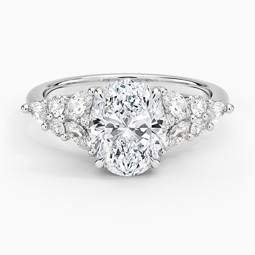 Oval moissanite with fanned marquise and round clusters in white gold, top view