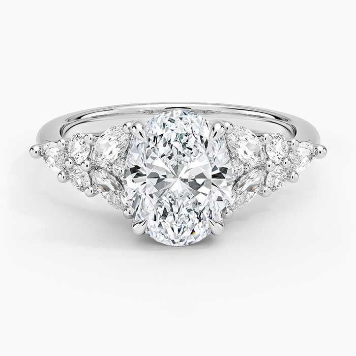 Oval moissanite with fanned marquise and round clusters in white gold, top view