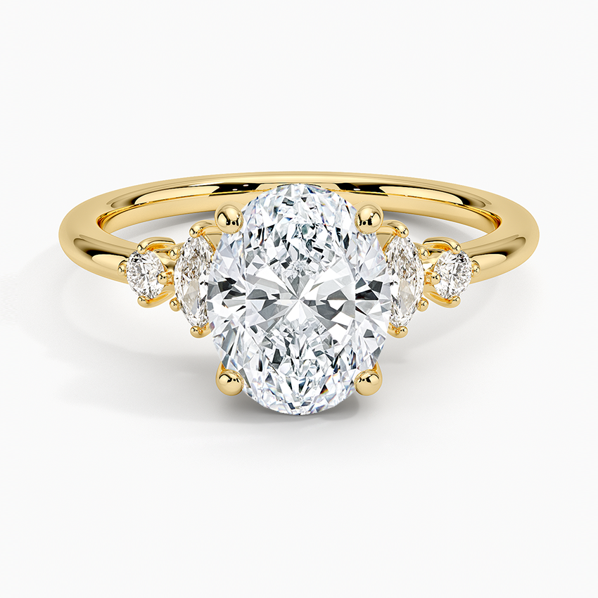 Oval moissanite with marquise and round accents each side in yellow gold, top view