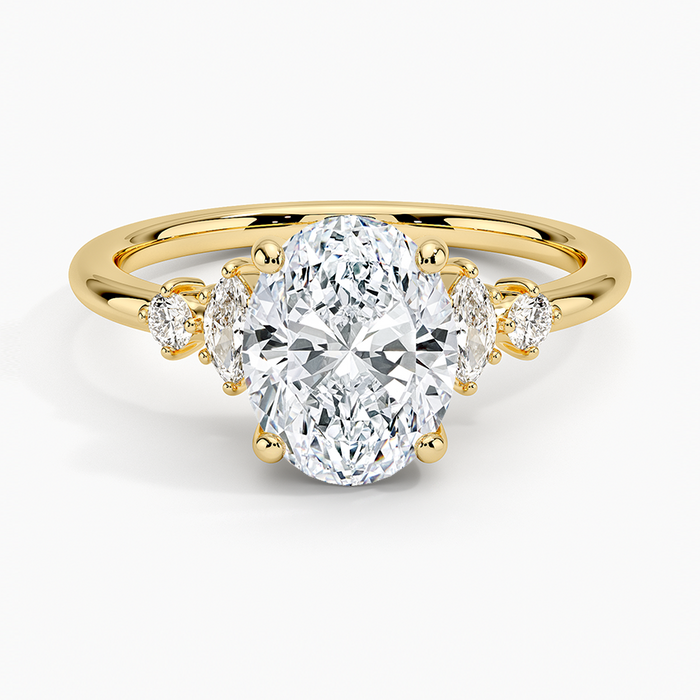 Oval moissanite with marquise and round accents each side in yellow gold, top view