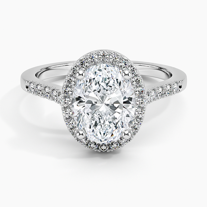 Oval moissanite in a floating pave halo in white gold, top view