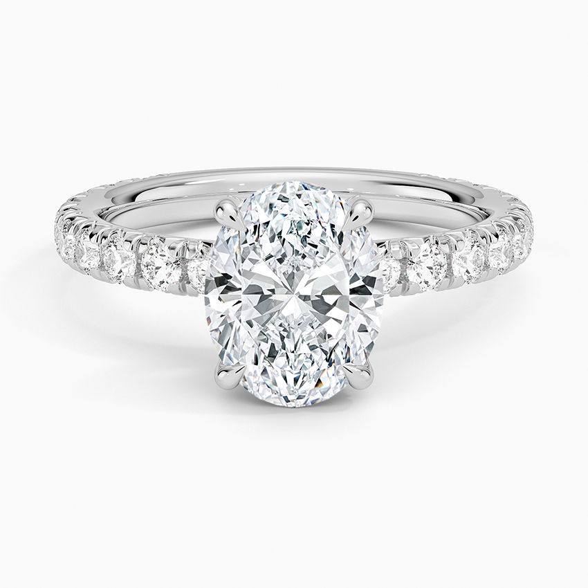 Oval moissanite hidden halo French pave engagement ring in white gold, top view