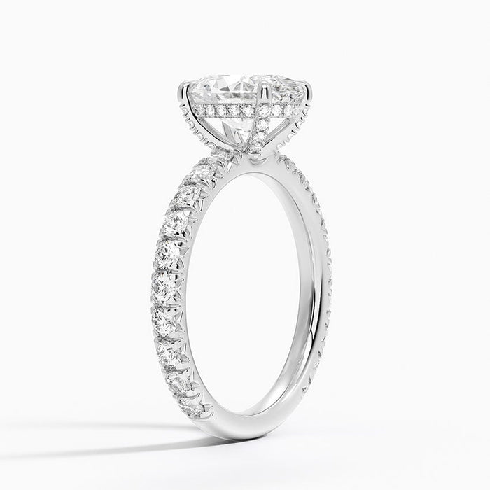 Side view showing the hidden halo, gallery wire and French pave shoulders
