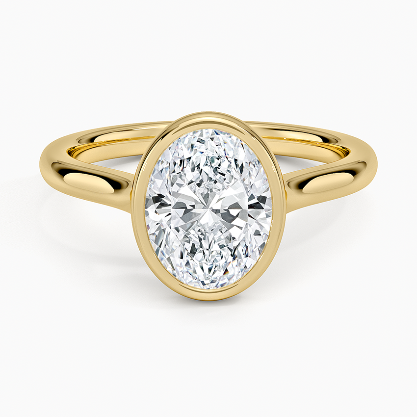 Oval moissanite full bezel solitaire engagement ring in yellow gold, top view