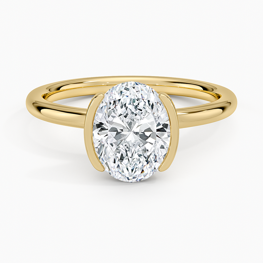 Oval moissanite in a half bezel open frame in yellow gold, top view