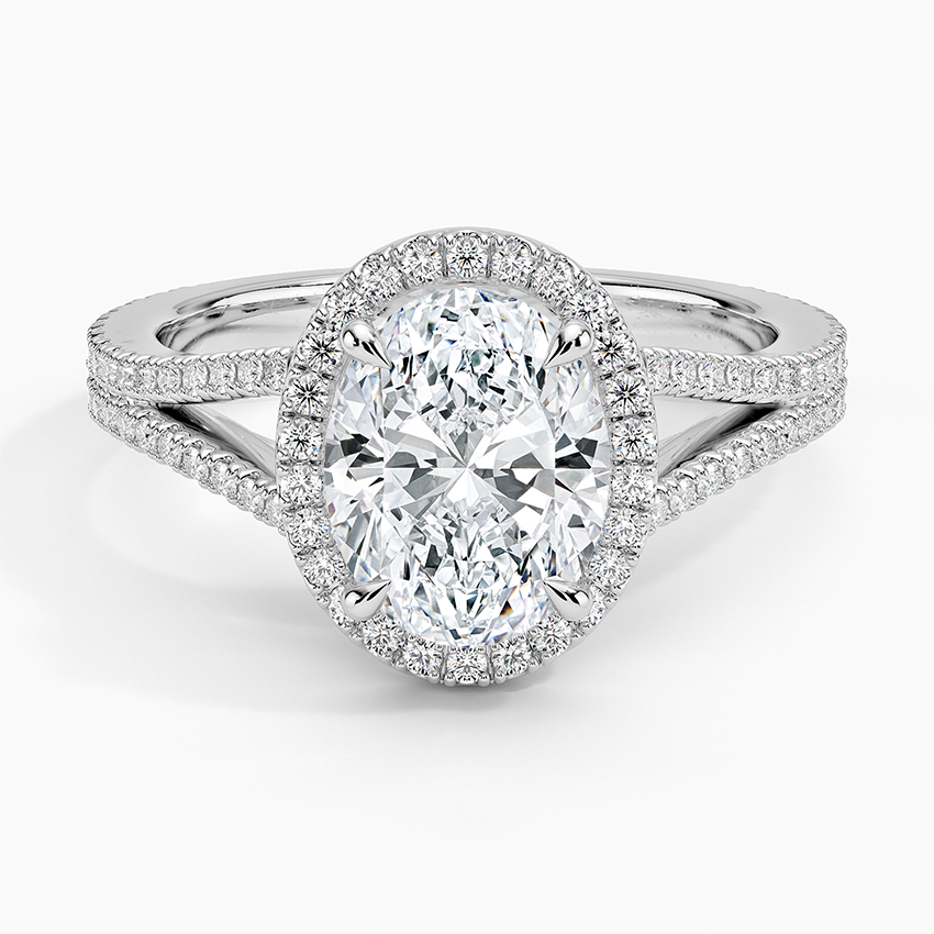 Oval moissanite with a micropave halo and pave split shank in white gold, top view