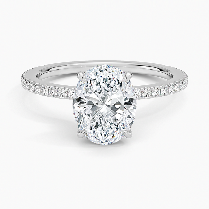 Oval moissanite hidden halo pave engagement ring in white gold, top view