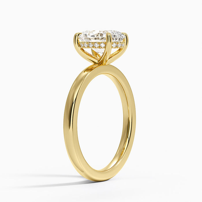 Side view showing the full hidden halo of round moissanite accents under the oval centre stone