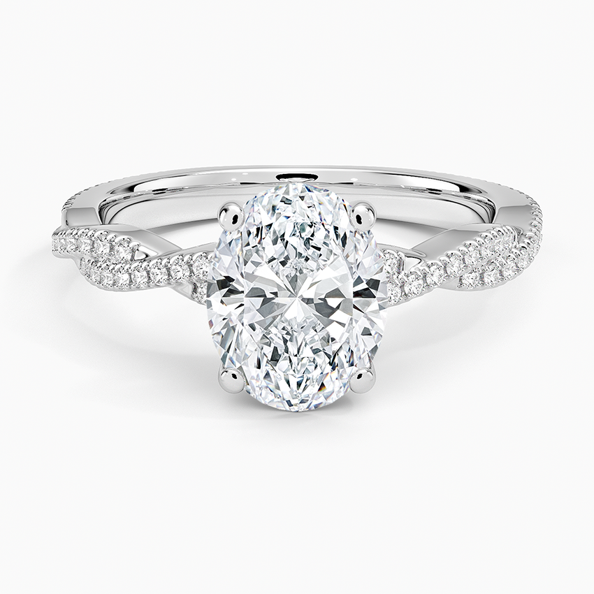 Oval moissanite on an infinity twist pave band in white gold, top view