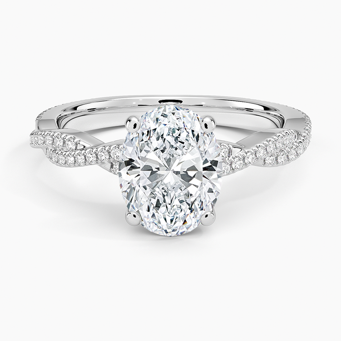Oval moissanite on an infinity twist pave band in white gold, top view