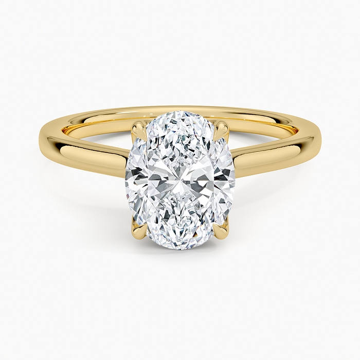 Oval moissanite knife edge solitaire engagement ring in yellow gold, top view