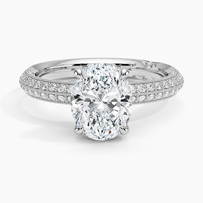 Oval moissanite on a knife edge double row pave band in white gold, top view