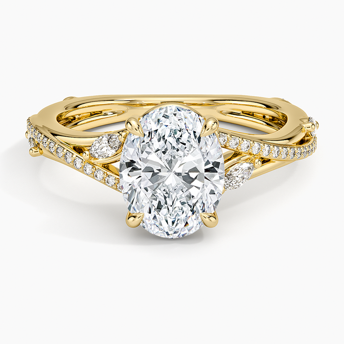 Oval moissanite with marquise leaves on a pave split shank in yellow gold, top view