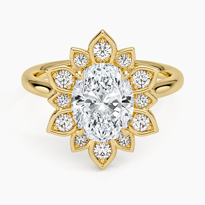 Oval moissanite inside a yellow gold petal halo with a round accent in each petal, top view