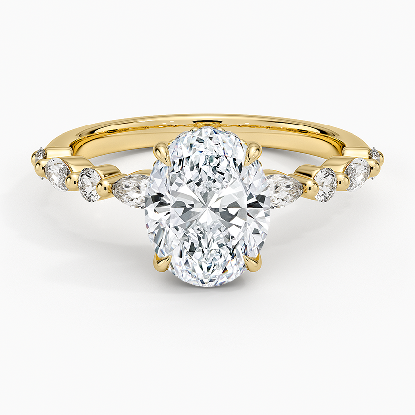Oval moissanite hidden halo ring with marquise and round shared prong band in yellow gold