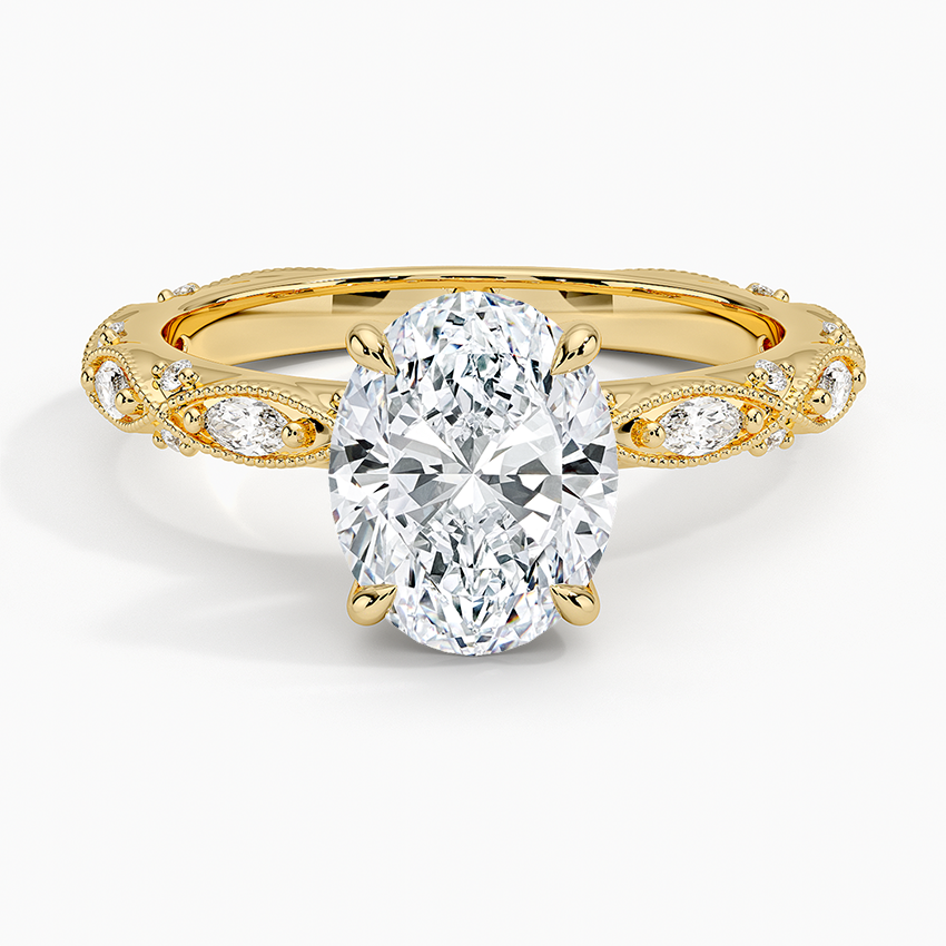 Oval moissanite on a marquise milgrain frame band in yellow gold, top view