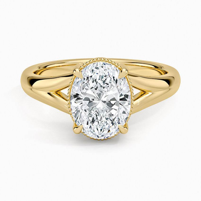Oval moissanite in a milgrain collar on a split shank in yellow gold, top view