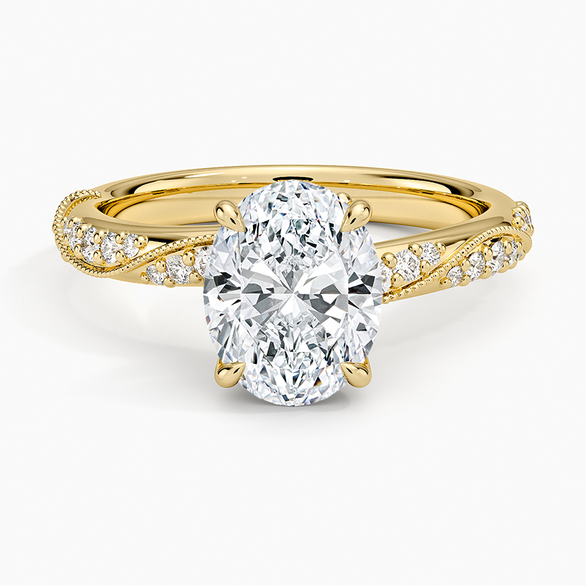 Oval moissanite on a milgrain twist pave band in yellow gold, top view