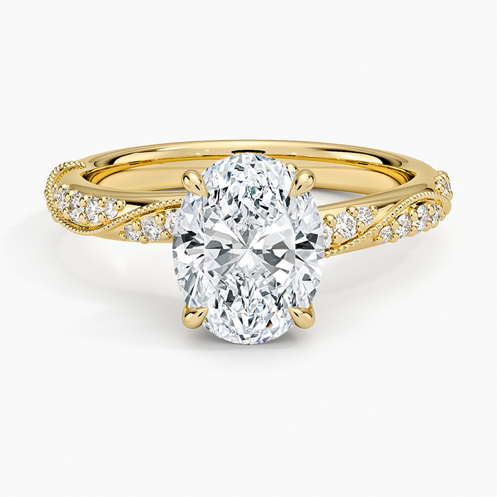 Oval moissanite on a milgrain twist pave band in yellow gold, top view