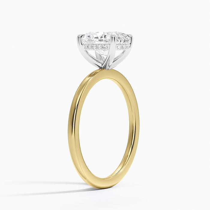 Side profile showing the white metal head with hidden halo above a yellow gold shank