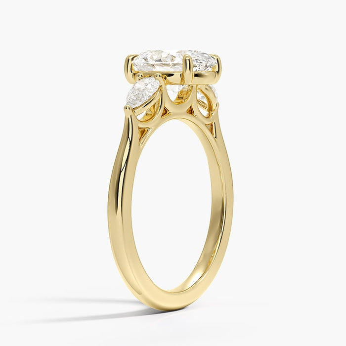Side view showing the pear side stones and plain rounded band