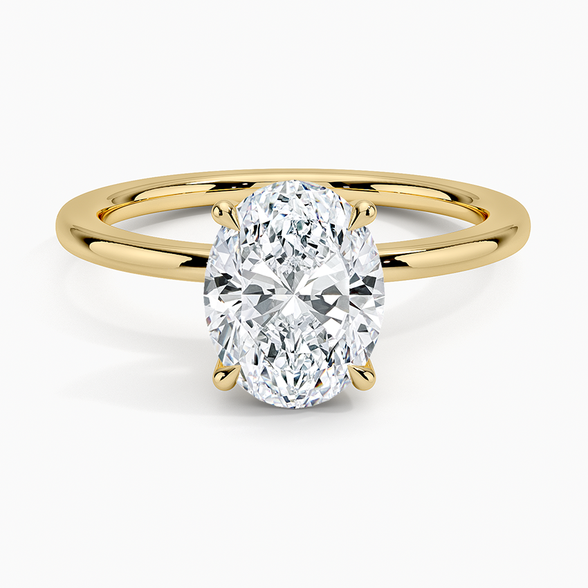 Oval moissanite perfect fit solitaire engagement ring in yellow gold, top view