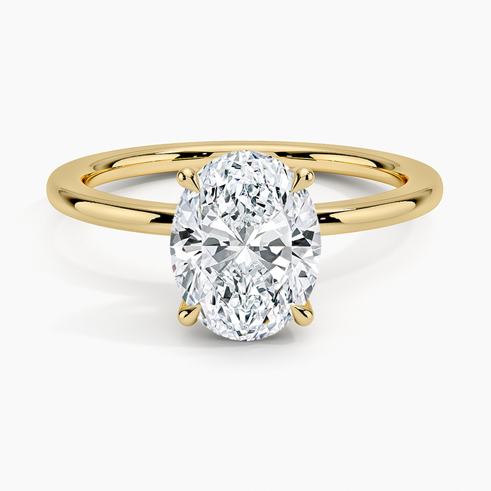 Oval moissanite perfect fit solitaire engagement ring in yellow gold, top view