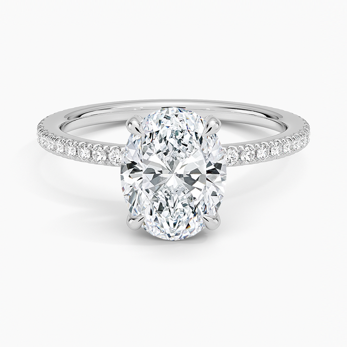 Oval moissanite hidden halo petite pave engagement ring in white gold, top view
