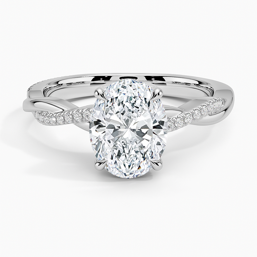 Oval moissanite on a petite twisted vine pave band in white gold, top view