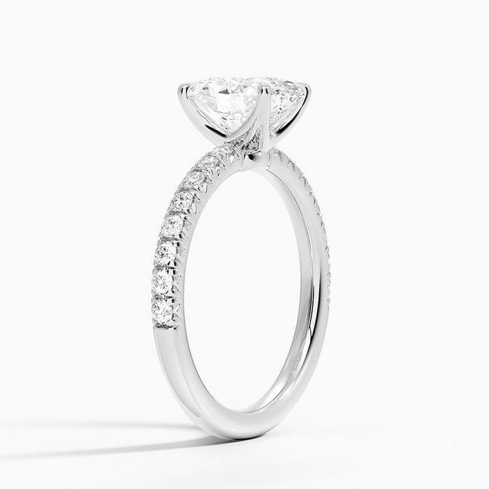 Side view of the scalloped pave shoulders and compact four prong head
