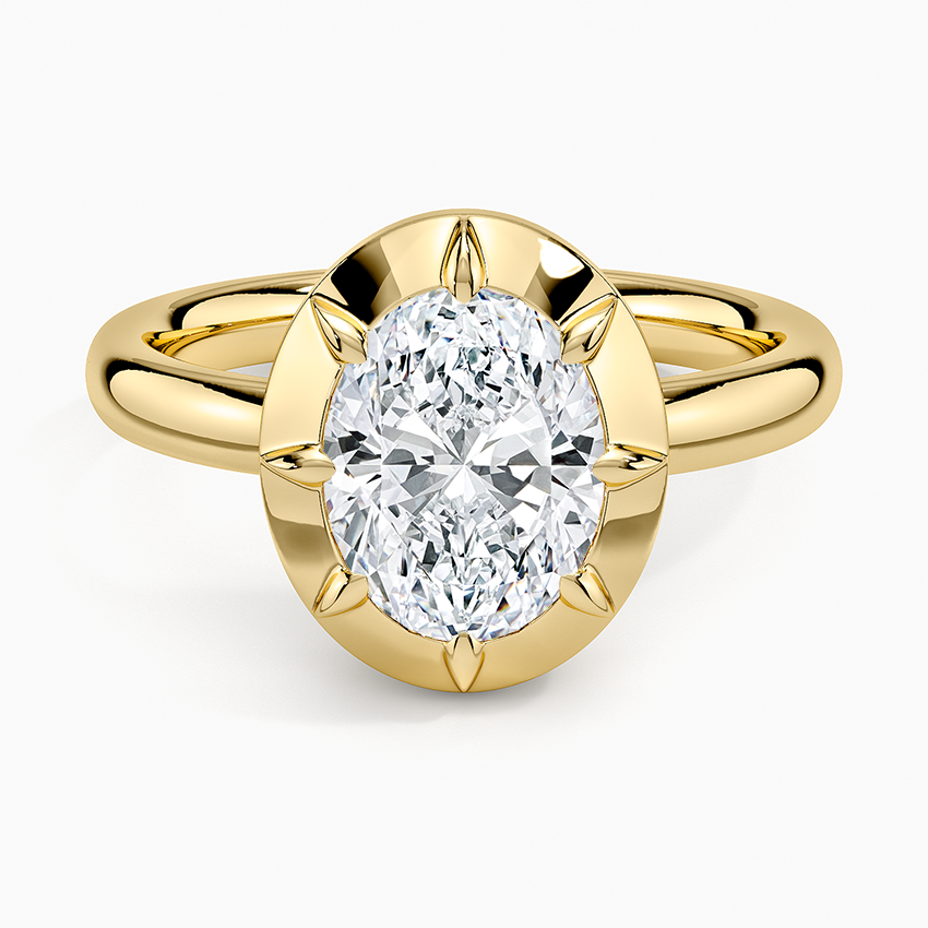 Oval moissanite in a solid gold halo with six pointed claws, top view
