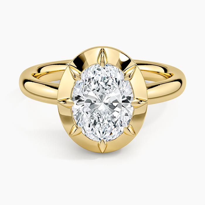 Oval moissanite in a solid gold halo with six pointed claws, top view