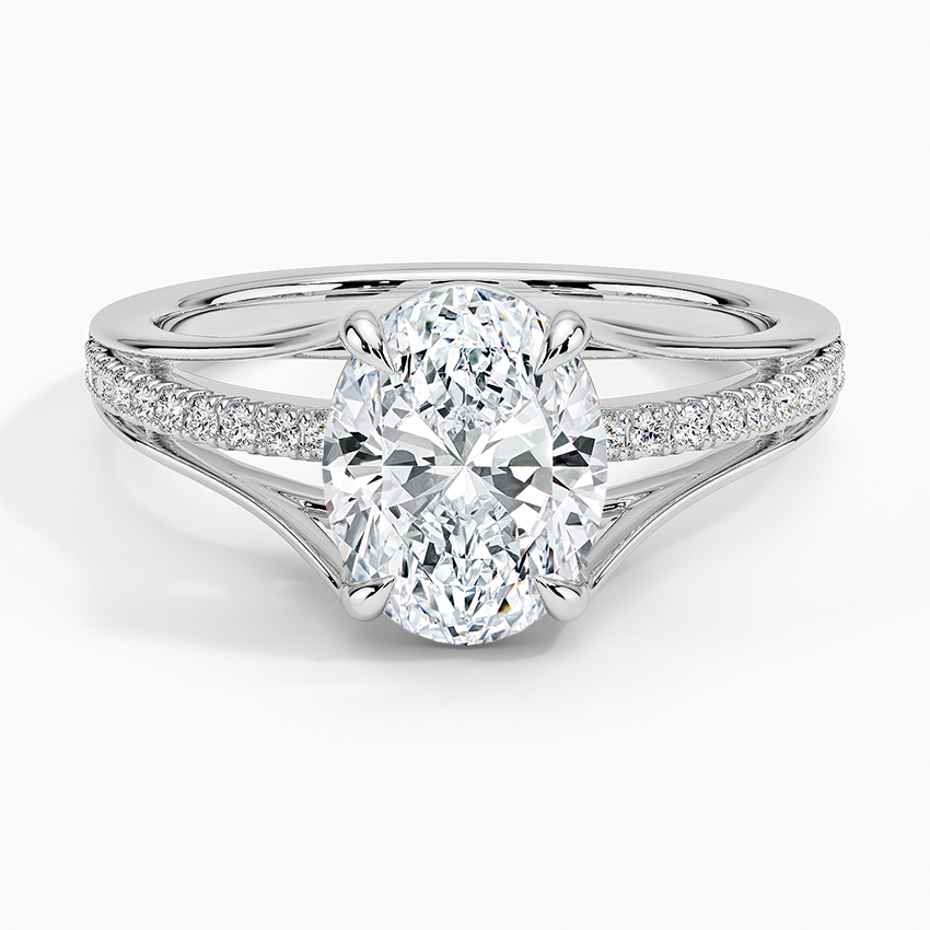 Oval moissanite with pave shoulders splitting into a plain V in white gold, top view
