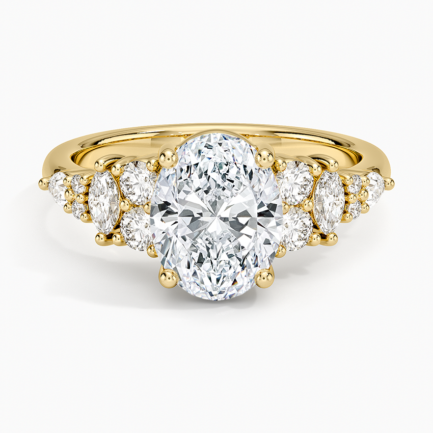 Oval moissanite with alternating round and marquise accents in yellow gold, top view