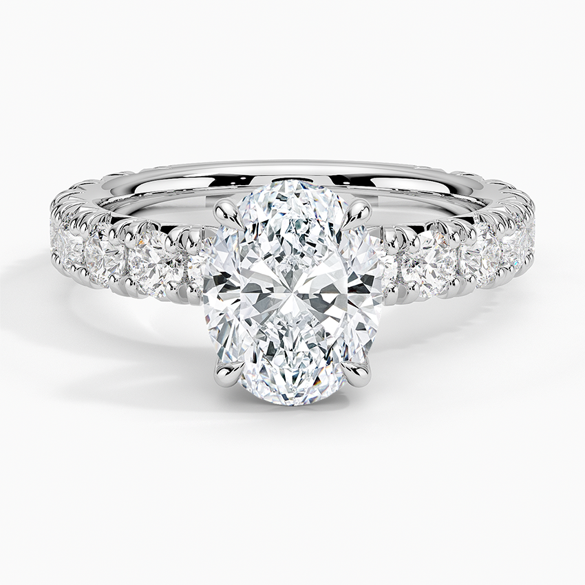 Oval moissanite with a triple row pave band in white gold, top view
