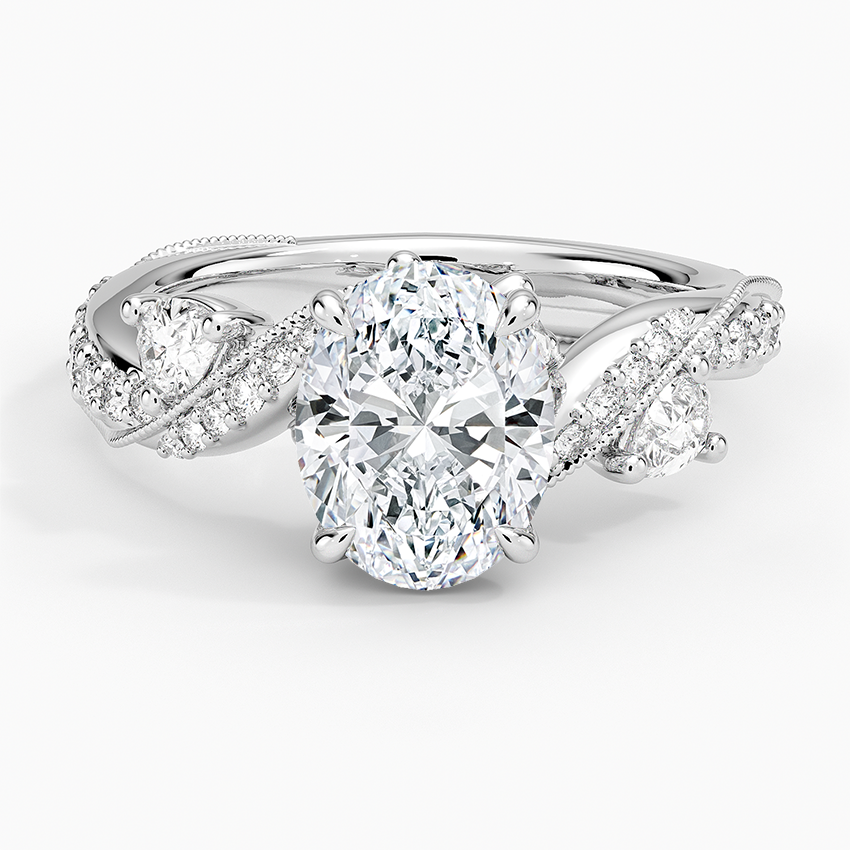 Oval moissanite on a twisted pave vine with bud accents in white gold, top view