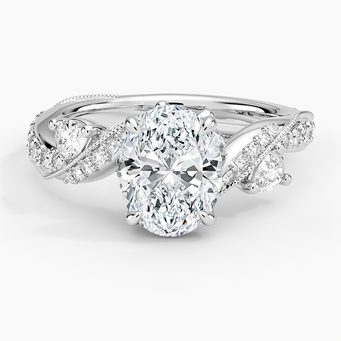 Oval moissanite on a twisted pave vine with bud accents in white gold, top view
