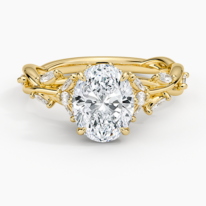 Oval moissanite nature inspired vine and leaf engagement ring in yellow gold, front view