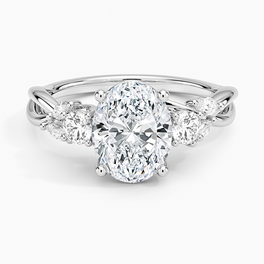 Oval moissanite vine three stone engagement ring in white gold, top view