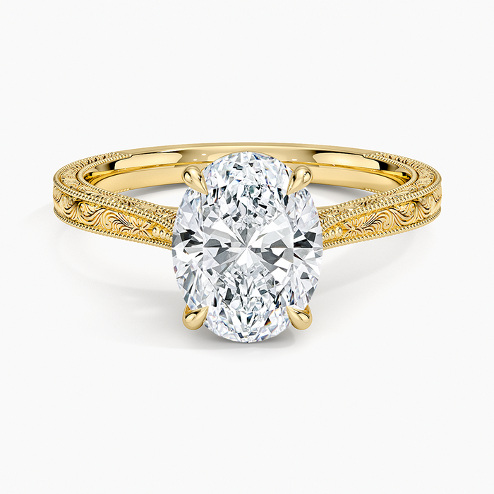 Oval moissanite vintage hand engraved solitaire ring in yellow gold, top view
