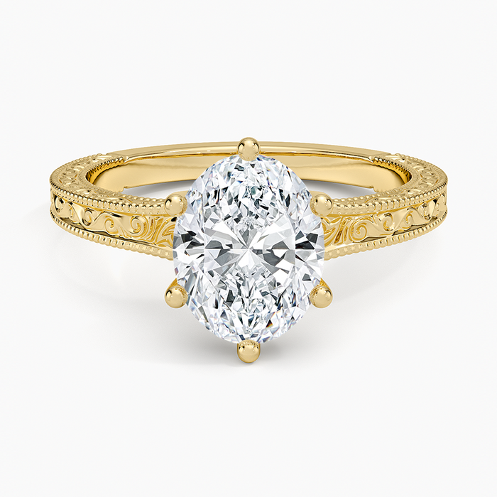 Oval moissanite vintage scroll engraved engagement ring in yellow gold, top view