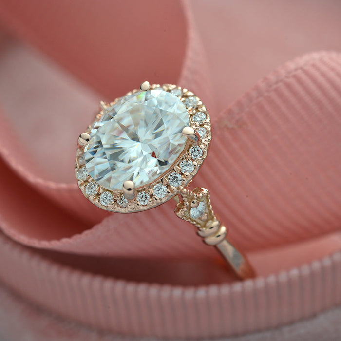Oval cut moissanite vintage halo engagement ring with milgrained cluster shoulders in rose gold, view 2