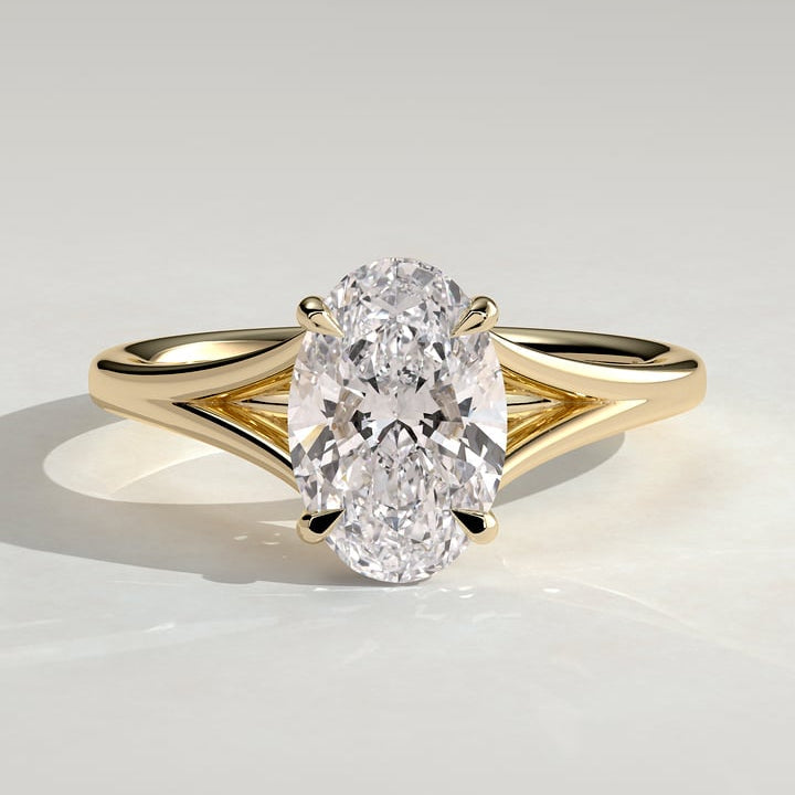 Oval cut moissanite V split shank solitaire engagement ring in yellow gold