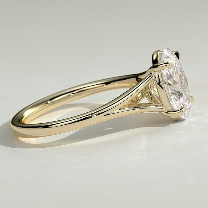 Oval cut moissanite V split shank solitaire engagement ring in yellow gold, view 2
