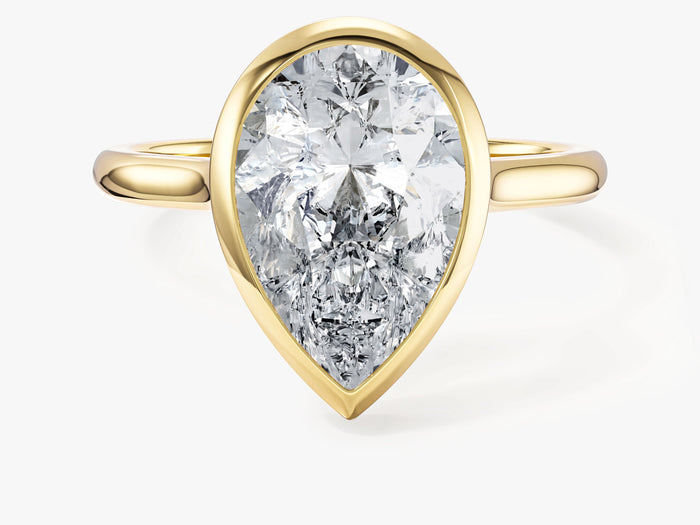 Large pear lab grown diamond bezel statement engagement ring in yellow gold, front view