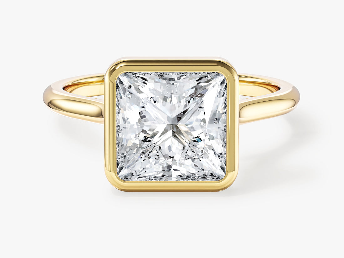Large princess moissanite bezel statement engagement ring in yellow gold, front view