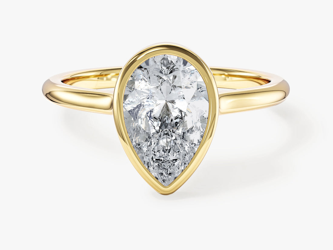 Teardrop pear shaped moissanite full bezel engagement ring in yellow gold, front view
