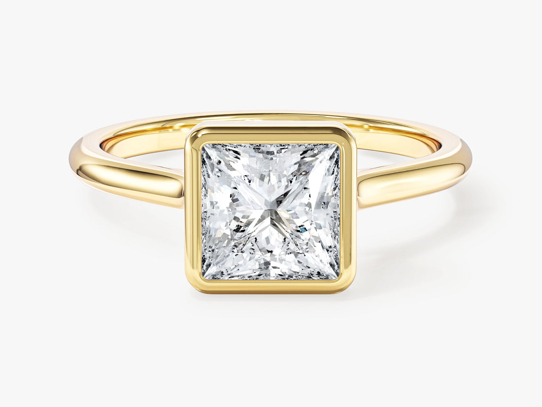 Princess cut lab grown diamond bezel set solitaire engagement ring in yellow gold, front view